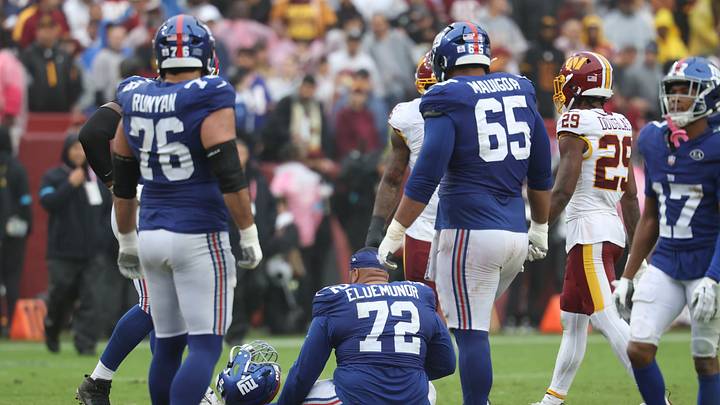 Oct 11, 2026; Landover, Maryland, USA; New York Giants offensive line Jermaine Eluemunor (72) sits on the field after an injury during the third quarter against the Washington Commanders at Northwest Stadium. Oct 11, 2026; Landover, Maryland, USA; New York Giants offensive line Jermaine Eluemunor (72) sits on the field after an injury during the third quarter against the Washington Commanders at Northwest Stadium.