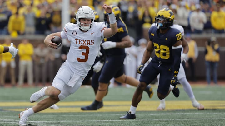 Sep 7, 2024; Ann Arbor, Michigan, USA; Texas Longhorns quarterback Quinn Ewers (3) rushes in the first half against the Michigan Wolverines at Michigan Stadium.
