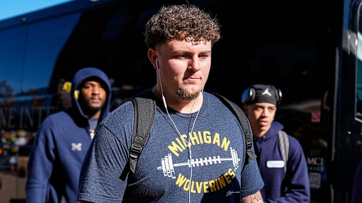 Michigan defensive lineman Mason Graham (55) walks off the bus as team arrive for the Oregon game at Michigan Stadium in Ann Arbor on Saturday, Nov. 2, 2024. Michigan defensive lineman Mason Graham (55) walks off the bus as team arrive for the Oregon game at Michigan Stadium in Ann Arbor on Saturday, Nov. 2, 2024.