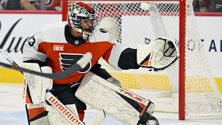 Apr 14, 2026; Philadelphia, Pennsylvania, USA; Philadelphia Flyers goaltender Samuel Ersson (33) makes a save against the Montréal Canadiens during the third period at Xfinity Mobile Arena. 