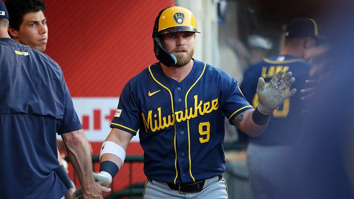 Aug 1, 2026; Anaheim, California, USA;  Milwaukee Brewers right fielder Jake Bauers (9) is greeted in the dugout after hitting a home run during the fourth inning against the Los Angeles Angels at Angel Stadium. Mandatory Credit: Kiyoshi Mio-Imagn Images