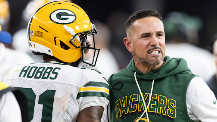 Oct 19, 2025; Glendale, Arizona, USA; Green Bay Packers head coach Matt LaFleur with cornerback Nate Hobbs (21) against the Arizona Cardinals at State Farm Stadium. Oct 19, 2025; Glendale, Arizona, USA; Green Bay Packers head coach Matt LaFleur with cornerback Nate Hobbs (21) against the Arizona Cardinals at State Farm Stadium.