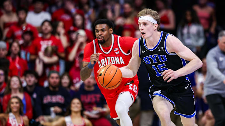 Feb 22, 2025; Tucson, Arizona, USA; BYU Cougars guard Richie Saunders (15) dribbles the ball while Arizona Wildcats guard KJ Lewis (5) follows him during the first half at McKale Center. Mandatory Credit: Aryanna Frank-Imagn Images