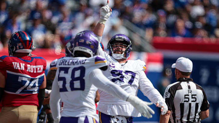 Sep 8, 2024; East Rutherford, New Jersey, USA; Minnesota Vikings defensive tackle Harrison Phillips (97) celebrates a defensive stop during the second half against the New York Giants at MetLife Stadium. Mandatory Credit: Vincent Carchietta-Imagn Images