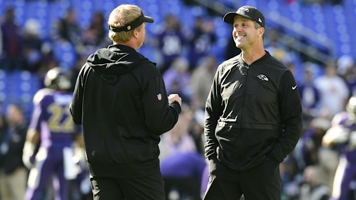 Baltimore Ravens head coach John Harbaugh and Oakland Raiders head coach Jon Gruden speak before the game.