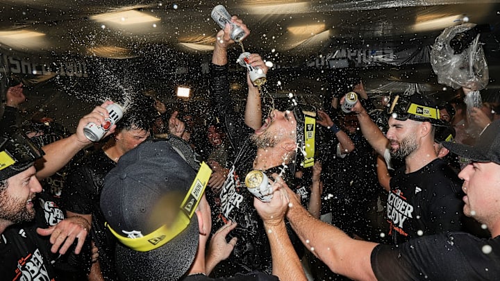 Detroit Tigers pitcher Alex Faedo, center, celebrates with teammates in the clubhouse after 4-1 win over Chicago White Sox to clinch a playoff spot at Comerica Park in Detroit on Friday, Sept. 27, 2024.