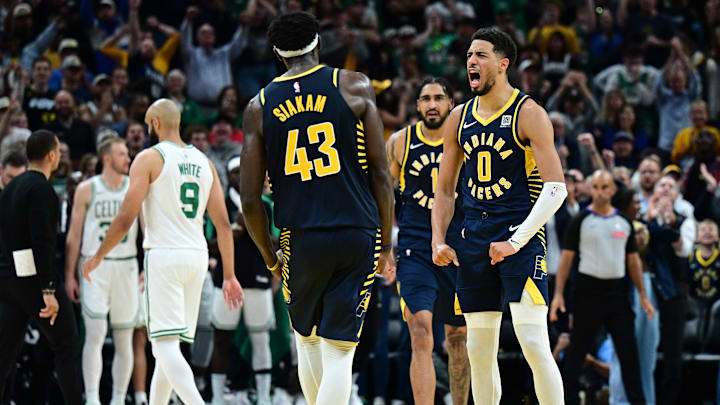 Oct 30, 2024; Indianapolis, Indiana, USA; Indiana Pacers guard Tyrese Haliburton (0) reacts to forward Pascal Siakam (43) making a three point shot to win the game against the Boston Celtics at Gainbridge Fieldhouse. Mandatory Credit: Marc Lebryk-Imagn Images