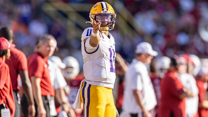 Nov 15, 2025; Baton Rouge, Louisiana, USA; LSU Tigers quarterback Michael van Buren Jr. (11) reacts to running for a first down against the Arkansas Razorbacks during the second half at Tiger Stadium. Mandatory Credit: Stephen Lew-Imagn Images Nov 15, 2025; Baton Rouge, Louisiana, USA; LSU Tigers quarterback Michael van Buren Jr. (11) reacts to running for a first down against the Arkansas Razorbacks during the second half at Tiger Stadium. Mandatory Credit: Stephen Lew-Imagn Images
