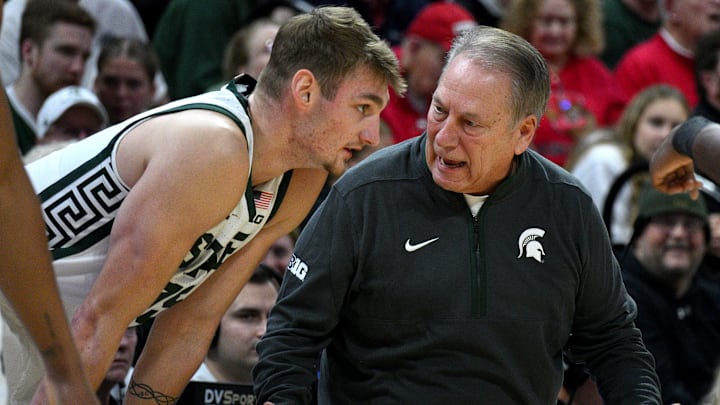 Dec 29, 2025; East Lansing, Michigan, USA; Michigan State Spartans head coach Tom Izzo talks with Michigan State Spartans center Carson Cooper (15) during the first half against the Cornell Big Red at Jack Breslin Student Events Center. Mandatory Credit: Dale Young-Imagn Images
