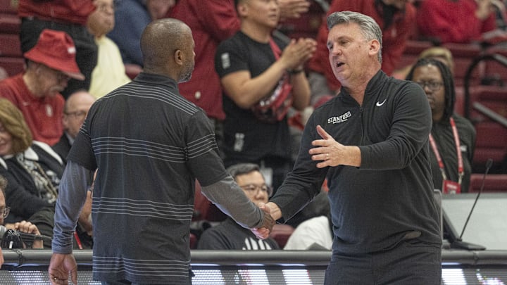 Feb 26, 2025; Stanford, California, USA;  Boston College Eagles head coach Earl Grant (left) shakes hands with Stanford Cardinal head coach Kyle Smith after the game at Maples Pavilion. Mandatory Credit: Stan Szeto-Imagn Images