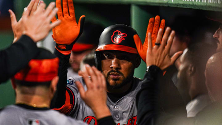 Sep 11, 2024; Boston, Massachusetts, USA; Baltimore Orioles designated hitter Anthony Santander (25) is congratulated after hitting a home run against the Boston Red Sox in the eighth inning at Fenway Park. Mandatory Credit: David Butler II-Imagn Images
