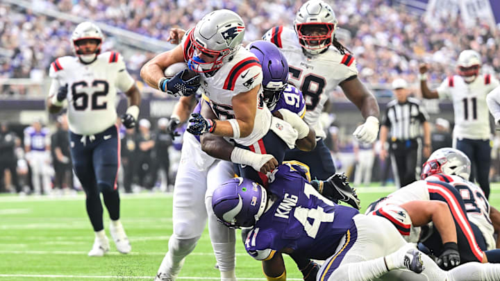 Aug 16, 2025; Minneapolis, Minnesota, USA; New England Patriots wide receiver Efton Chism III (86) scores a touchdown as Minnesota Vikings linebacker Kobe King (41) and defensive end Alex Williams (99) attempt to make the stop during the second quarter at U.S. Bank Stadium. Mandatory Credit: Jeffrey Becker-Imagn Images Aug 16, 2025; Minneapolis, Minnesota, USA; New England Patriots wide receiver Efton Chism III (86) scores a touchdown as Minnesota Vikings linebacker Kobe King (41) and defensive end Alex Williams (99) attempt to make the stop during the second quarter at U.S. Bank Stadium. Mandatory Credit: Jeffrey Becker-Imagn Images