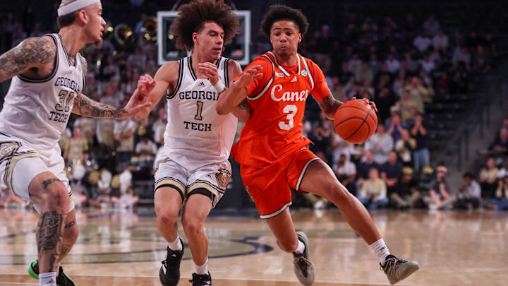 Mar 4, 2025; Atlanta, Georgia, USA; Georgia Tech Yellow Jackets guard Naithan George (1) defends Miami Hurricanes guard Jalil Bethea (3) in the first half at McCamish Pavilion. Mandatory Credit: Brett Davis-Imagn Images