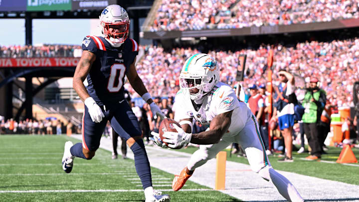 Oct 6, 2024; Foxborough, Massachusetts, USA; Miami Dolphins wide receiver Tyreek Hill (10) steps out of bounds in the end zone in front of New England Patriots cornerback Christian Gonzalez (0) during the second half at Gillette Stadium. Oct 6, 2024; Foxborough, Massachusetts, USA; Miami Dolphins wide receiver Tyreek Hill (10) steps out of bounds in the end zone in front of New England Patriots cornerback Christian Gonzalez (0) during the second half at Gillette Stadium.