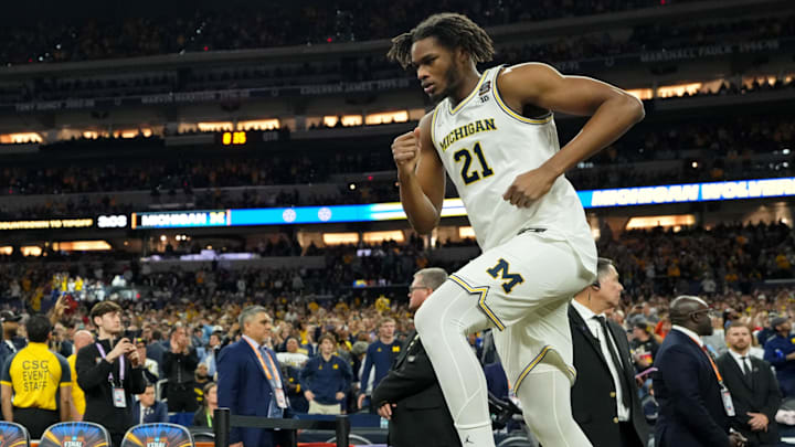 Apr 6, 2026; Indianapolis, IN, USA; Michigan Wolverines forward Morez Johnson Jr. (21) runs onto the court.
