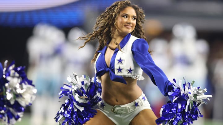 A Dallas Cowboys cheerleader performs during the second half against the Seattle Seahawks. A Dallas Cowboys cheerleader performs during the second half against the Seattle Seahawks.