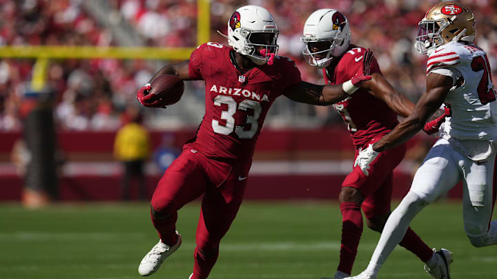 Sep 21, 2025; Santa Clara, California, USA; Arizona Cardinals running back Trey Benson (33) carries the ball as San Francisco 49ers safety Jason Pinnock (25) defends during the second half at Levi's Stadium. Mandatory Credit: Cary Edmondson-Imagn Images Sep 21, 2025; Santa Clara, California, USA; Arizona Cardinals running back Trey Benson (33) carries the ball as San Francisco 49ers safety Jason Pinnock (25) defends during the second half at Levi's Stadium. Mandatory Credit: Cary Edmondson-Imagn Images