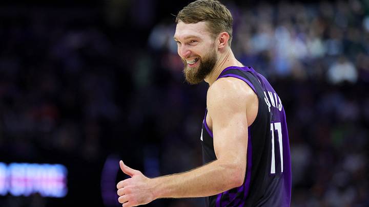 Jan 1, 2025; Sacramento, California, USA; Sacramento Kings forward Domantas Sabonis (11) smiles towards the Philadelphia 76ers bench during the third quarter at Golden 1 Center. Mandatory Credit: Sergio Estrada-Imagn Images