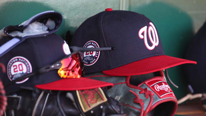 Apr 17, 2025; Pittsburgh, Pennsylvania, USA; Washington Nationals hats and gloves in the dugout against the Pittsburgh Pirates during the sixth inning at PNC Park. Mandatory Credit: Charles LeClaire-Imagn Images Apr 17, 2025; Pittsburgh, Pennsylvania, USA; Washington Nationals hats and gloves in the dugout against the Pittsburgh Pirates during the sixth inning at PNC Park. Mandatory Credit: Charles LeClaire-Imagn Images