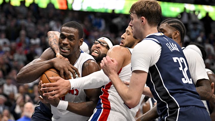 Dec 18, 2025; Dallas, Texas, USA; Detroit Pistons center Jalen Duren (0) and guard Cade Cunningham (2) and Dallas Mavericks forward Anthony Davis (3) and forward Cooper Flagg (32) battle for the ball during overtime at the American Airlines Center. Mandatory Credit: Jerome Miron-Imagn Images