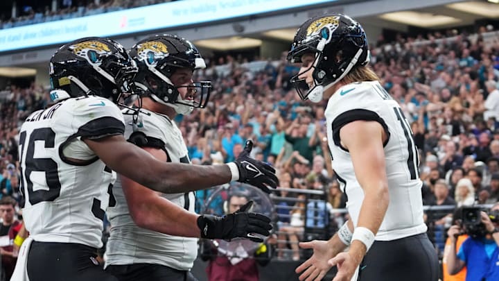 Nov 2, 2025; Paradise, Nevada, USA; Jacksonville Jaguars quarterback Trevor Lawrence (16) scores a touchdown during the second half against the Las Vegas Raiders at Allegiant Stadium. Mandatory Credit: Kirby Lee-Imagn Images