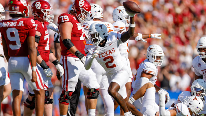 Texas Longhorns defensive back Derek Williams Jr. recovers a fumble during the second quarter against the Oklahoma Sooners