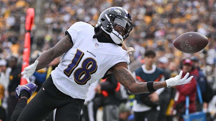 Nov 17, 2024; Pittsburgh, Pennsylvania, USA; Baltimore Ravens wide receiver Diontae Johnson (18) reaches for an incomplete pass against the Pittsburgh Steelers during the first quarter at Acrisure Stadium. Mandatory Credit: Barry Reeger-Imagn Images