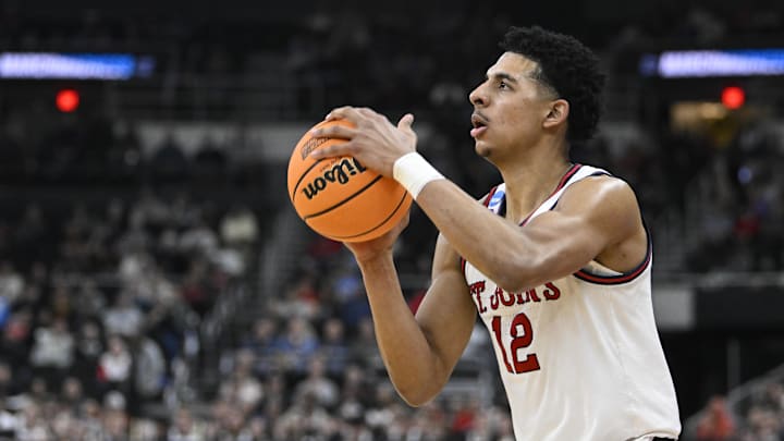 Mar 20, 2025; Providence, RI, USA;  St. John's basketball guard RJ Luis Jr. (12) puts up a shot during the second half against the Omaha Mavericks at Amica Mutual Pavilion.