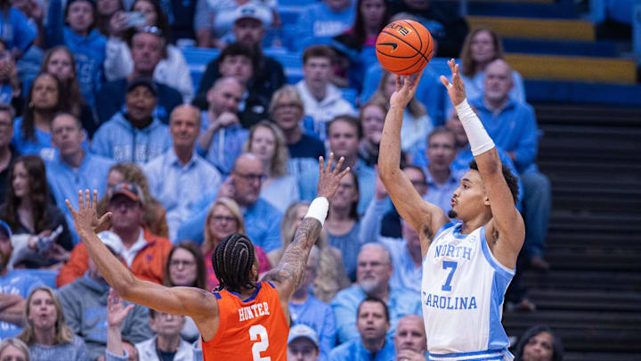 Mar 3, 2026; Chapel Hill, North Carolina, USA;  North Carolina Tar Heels guard Seth Trimble (7) shoots the ball over Clemson Tigers guard Dillon Hunter (2) during the first half at Dean E. Smith Center. Mandatory Credit: Scott Kinser-Imagn Images
