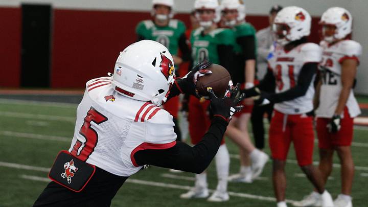 Louisville’s Caullin Lacy (5) catches the ball during Spring Practice