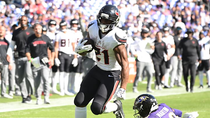 Oct 5, 2025; Baltimore, Maryland, USA; Houston Texans running back Nick Chubb (21) runs for a gain past Baltimore Ravens cornerback Keyon Martin (38) during the third quarter at M&T Bank Stadium. Mandatory Credit: Rafael Suanes-Imagn Images