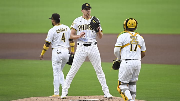 Aug 19, 2025; San Diego, California, USA; San Diego Padres starting pitcher Nick Pivetta (27) talks with Elias Diaz (17) during the first inning against the San Francisco Giants at Petco Park. Mandatory Credit: Denis Poroy-Imagn Images