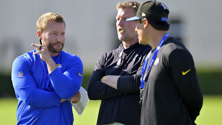 Jul 29, 2024; Los Angeles, CA, USA; Los Angeles Rams head coach Sean McVay, general manager Les Snead and chief of staff Carter Crutchfield talk on the field during training camp at Loyola Marymount University. Mandatory Credit: Jayne Kamin-Oncea-Imagn Images