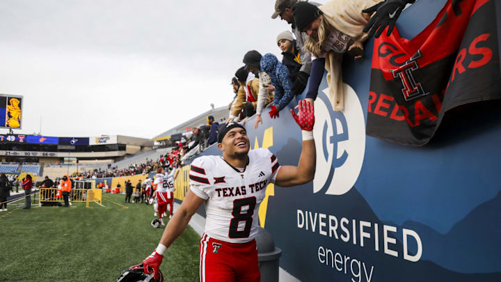 Nov 29, 2025; Morgantown, West Virginia, USA; Texas Tech Red Raiders running back Cameron Dickey (8) celebrates after defeating the West Virginia Mountaineers  at Milan Puskar Stadium. Mandatory Credit: Ben Queen-Imagn Images
