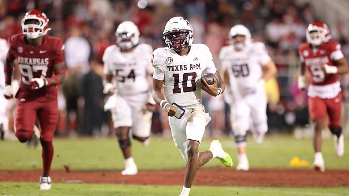 Texas A&M Aggies quarterback Mrcel Reed (10) rushes for a touchdown that was called back for holding during the fourth quarter against the Arkansas Razorbacks at Donald W. Reynolds Razorback Stadium. Texas A&M Aggies quarterback Mrcel Reed (10) rushes for a touchdown that was called back for holding during the fourth quarter against the Arkansas Razorbacks at Donald W. Reynolds Razorback Stadium.