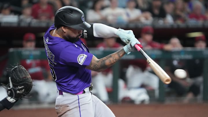Colorado Rockies shortstop Warming Bernabel (25) bats against the Arizona Diamondbacks during the third inning at Chase Field. Colorado Rockies shortstop Warming Bernabel (25) bats against the Arizona Diamondbacks during the third inning at Chase Field.
