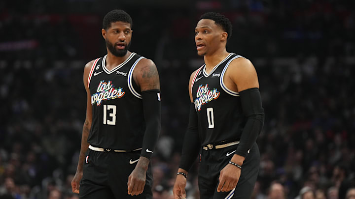 Feb 24, 2023; Los Angeles, California, USA; LA Clippers forward Paul George (13) and guard Russell Westbrook (0) react against the Sacramento Kings in the first half at Crypto.com Arena. Mandatory Credit: Kirby Lee-Imagn Images