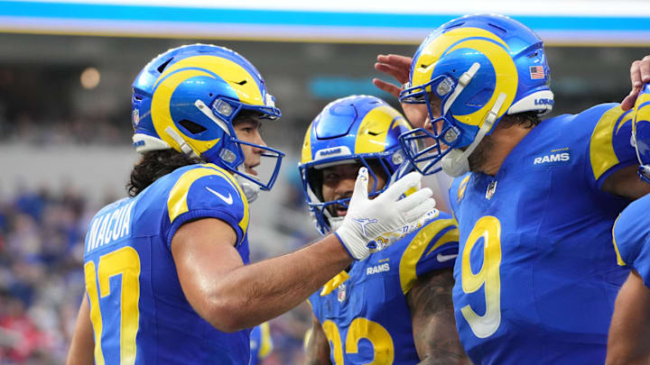 Dec 8, 2024; Inglewood, California, USA; Los Angeles Rams wide receiver Puka Nacua (17) celebrates with quarterback Matthew Stafford (9) and running back Kyren Williams (23) after scoring on a 4-yard touchdown run in the second quarter against the Buffalo Bills at SoFi Stadium. Mandatory Credit: Kirby Lee-Imagn Images