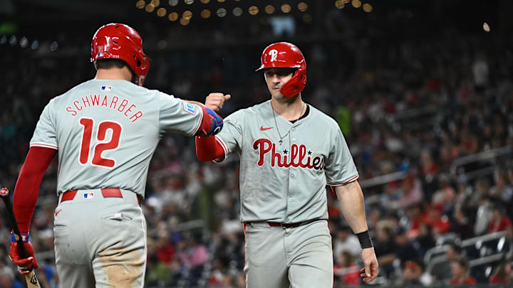 Sep 27, 2024; Washington, District of Columbia, USA;  Philadelphia Phillies outfielder Austin Hays (9) celebrates with designated hitter Kyle Schwarber (12) after hitting a home run against the Washington Nationals during the eighth inning at Nationals Park. Mandatory Credit: James A. Pittman-Imagn Images
