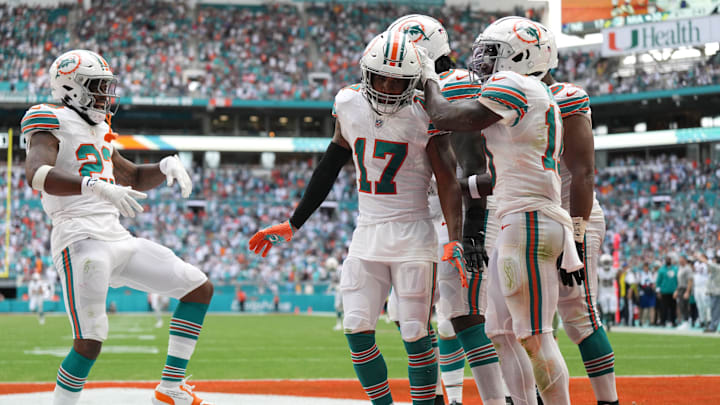 Miami Dolphins wide receiver Jaylen Waddle (17) waddles with teammates after scoring a touchdown