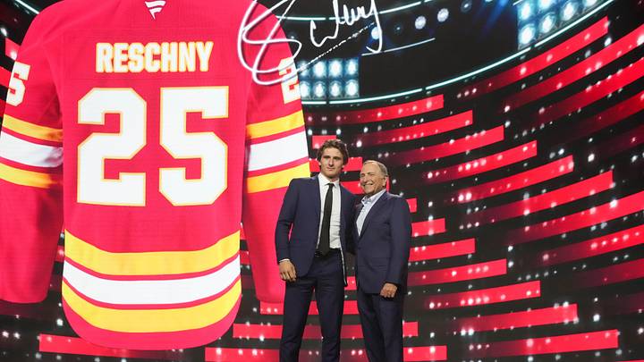 Jun 27, 2025; Los Angeles, California, USA; Cole Reschny is selected as the 18th overall pick to the Calgary Flames in the first round of the 2025 NHL Draft at Peacock Theater. Mandatory Credit: Kirby Lee-Imagn Images Jun 27, 2025; Los Angeles, California, USA; Cole Reschny is selected as the 18th overall pick to the Calgary Flames in the first round of the 2025 NHL Draft at Peacock Theater. Mandatory Credit: Kirby Lee-Imagn Images