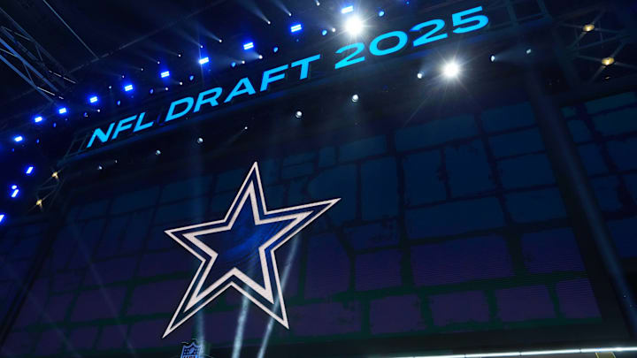 The Dallas Cowboys logo is projected on the video board during the NFL Draft at Lambeau Field. The Dallas Cowboys logo is projected on the video board during the NFL Draft at Lambeau Field.