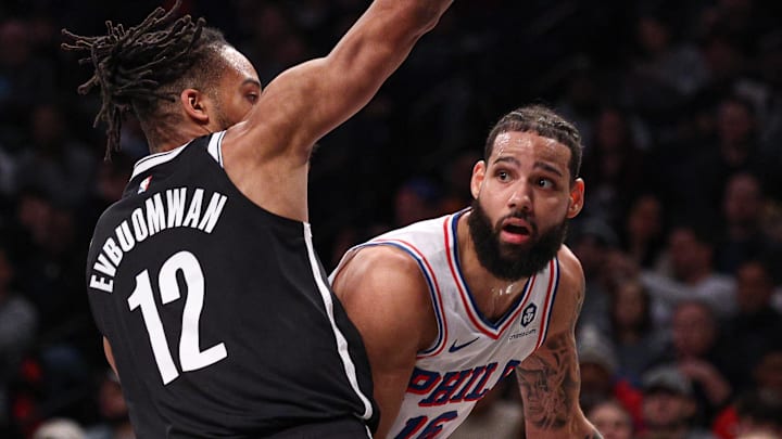 Jan 4, 2025; Brooklyn, New York, USA; Philadelphia 76ers forward Caleb Martin (16) looks to pass as Brooklyn Nets forward Tosan Evbuomwan (12) defends during the first half at Barclays Center. Mandatory Credit: Vincent Carchietta-Imagn Images Jan 4, 2025; Brooklyn, New York, USA; Philadelphia 76ers forward Caleb Martin (16) looks to pass as Brooklyn Nets forward Tosan Evbuomwan (12) defends during the first half at Barclays Center. Mandatory Credit: Vincent Carchietta-Imagn Images