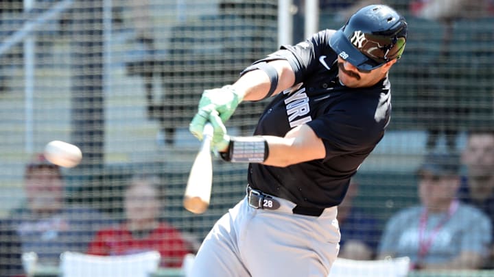 Mar 2, 2025; North Port, Florida, USA;  New York Yankees catcher Austin Wells (28) hits a single during the first inning against the Atlanta Braves at CoolToday Park. 