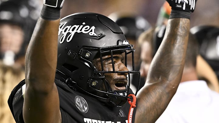 Oct 26, 2024; College Station, Texas, USA; Texas A&M Aggies running back Le'Veon Moss (8) reacts against the LSU Tigers during the third quarter. The Aggies defeated the Tigers 38-23; at Kyle Field. Mandatory Credit: Maria Lysaker-Imagn Images. 