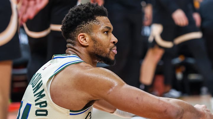 Jan 19, 2026; Atlanta, Georgia, USA; Milwaukee Bucks forward Giannis Antetokounmpo (34) sits on the ground after a collision against the Milwaukee Bucks during the fourth quarter at State Farm Arena.