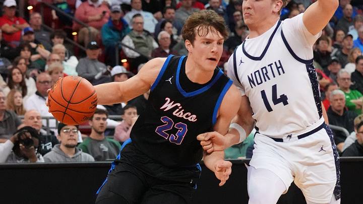 Wisconsin Lutheran's Zavier Zens (23) breaks around Appleton North's Ben Zdzieblowski (14) during their WIAA Division 1 state semifinal basketball game on Friday, March 20, 2026, at the Kohl Center in Madison, Wisconsin. Wisconsin Lutheran's Zavier Zens (23) breaks around Appleton North's Ben Zdzieblowski (14) during their WIAA Division 1 state semifinal basketball game on Friday, March 20, 2026, at the Kohl Center in Madison, Wisconsin.