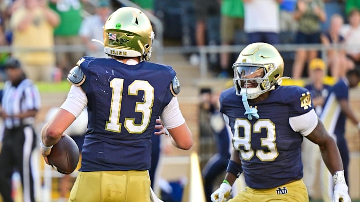 Sep 21, 2024; South Bend, Indiana, USA; Notre Dame Fighting Irish quarterback Riley Leonard (13) celebrates with wide receiver Jayden Thomas (83) after running for a touchdown in the fourth quarter against the Miami Redhawks at Notre Dame Stadium. Mandatory Credit: Matt Cashore-Imagn Images Sep 21, 2024; South Bend, Indiana, USA; Notre Dame Fighting Irish quarterback Riley Leonard (13) celebrates with wide receiver Jayden Thomas (83) after running for a touchdown in the fourth quarter against the Miami Redhawks at Notre Dame Stadium. Mandatory Credit: Matt Cashore-Imagn Images
