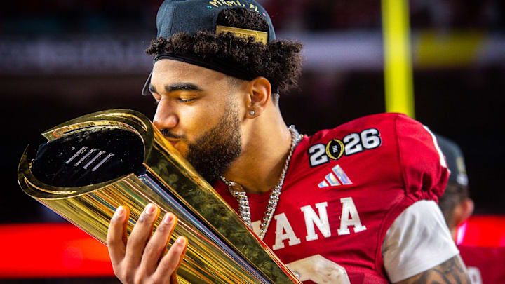 Indiana's Elijah Sarratt (13) kisses the trophy after the College Football Playoff National Championship college football game at Hard Rock Stadium in Miami Gardens on Monday, Jan. 19, 2026.