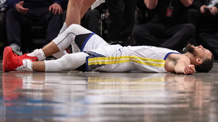 Golden State Warriors guard Stephen Curry (30) reacts after getting fouled in the fourth quarter against the Brooklyn Nets at Barclays Center. Mandatory Credit: Wendell Cruz-Imagn Images